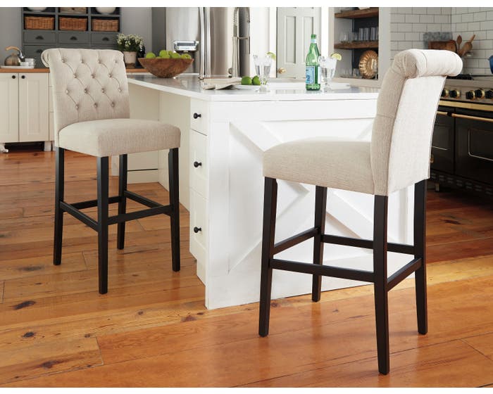 Signature Design by Ashley Tripton Tall Upholstered Bar Stool (Set of 2) in Linen D530-130